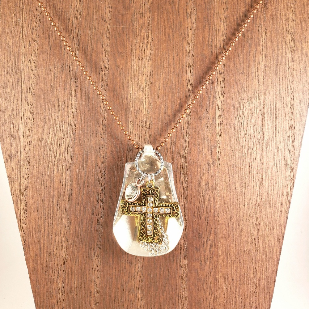Spoon with cross necklace